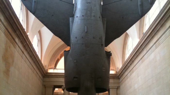 A life-sized metal model of a jet plane.