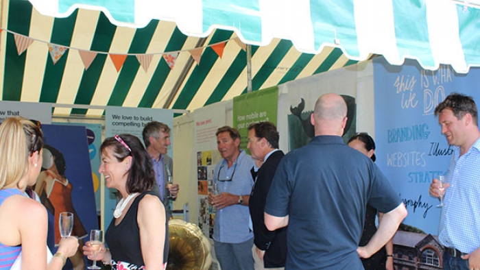 People talking in the Nixon tent at Royal Cornwall Show.