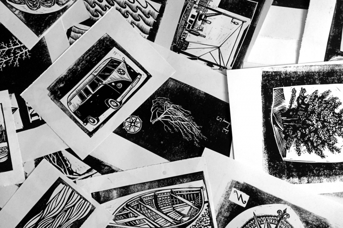 Sheets of linocut illustration prints.