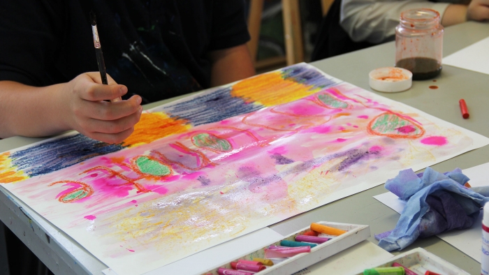 A Mounts Bay student creates a piece of art for the school prospectus.