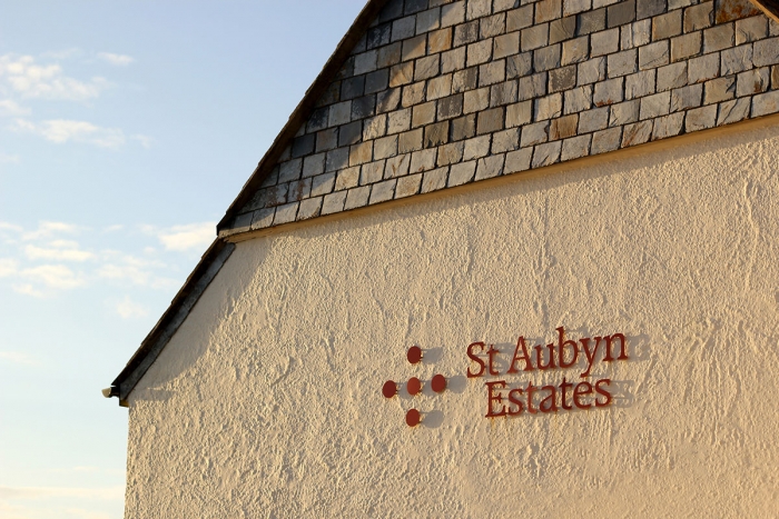 St Aubyn Estates signage on the side of a building.