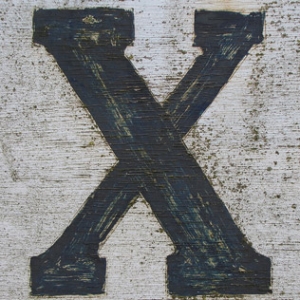 An X painted on wood.