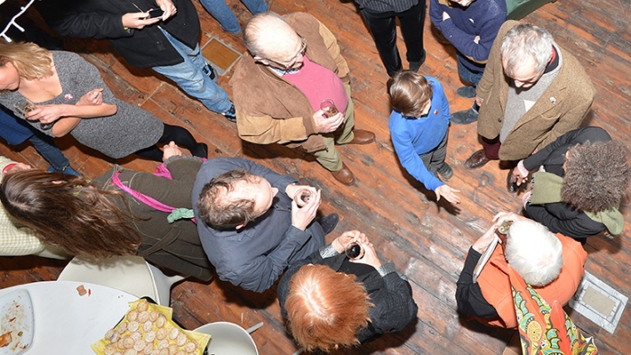 From above, partygoers chat to one another.
